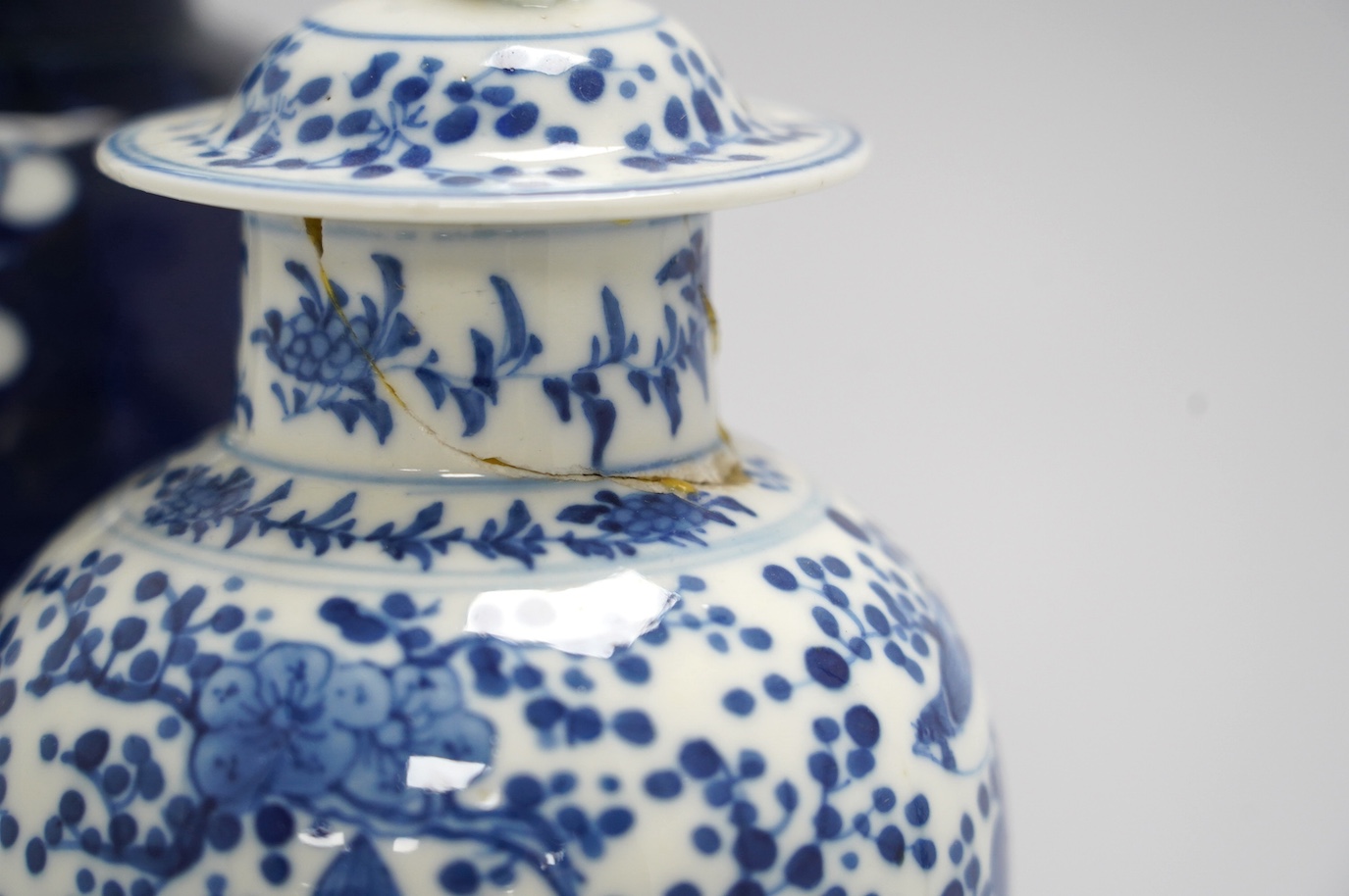 Ten Chinese blue and white baluster jars and covers including prunus flower examples, 19th century and later, tallest 35cm. Condition - poor to fair